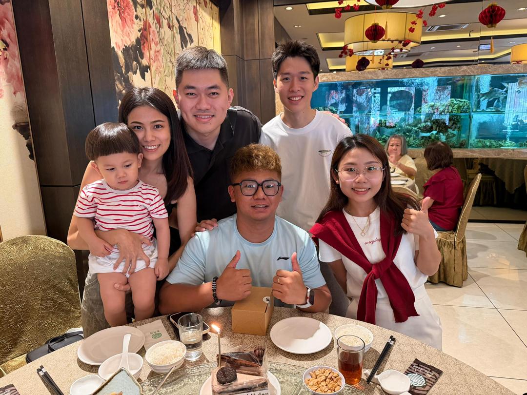 MyRoom Penang co-living management team celebrating with families — local Penang property managers behind every room rental and monthly owner payout
