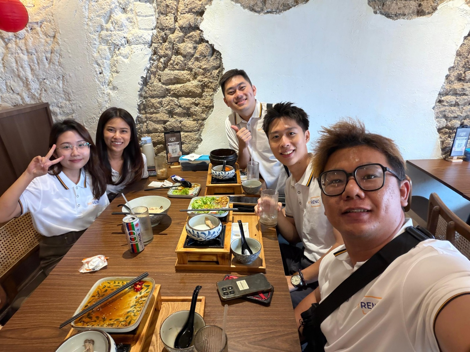 MyRoom Penang full-time property management staff during a team lunch in George Town — the people sourcing tenants, collecting rent and managing co-living units for Penang property owners